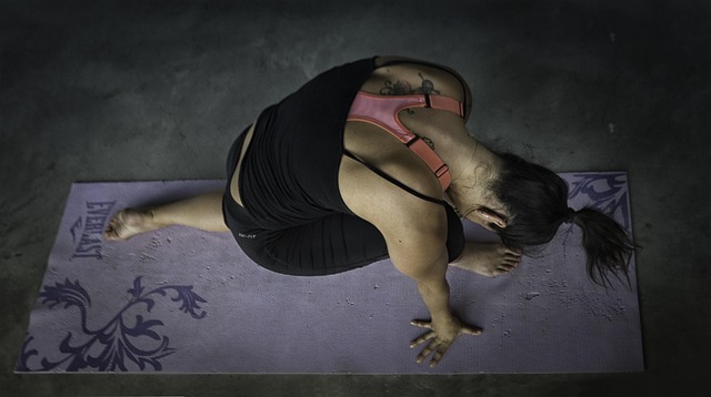 beginner yoga foundations class with instructor demonstrating posture alignment