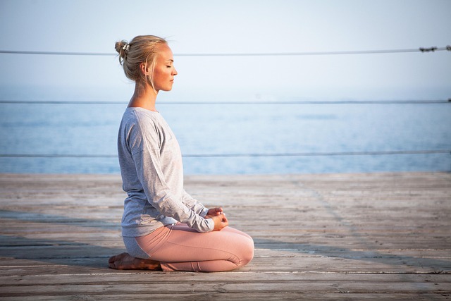 yoga practitioner in peaceful studio environment with natural light