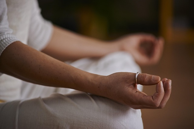 mindful movement yoga session with participant focusing on breath coordination